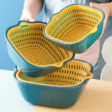 Three plastic colander baskets with a teal blue exterior and yellow interior, shown with one held by a person's hands against a light blue background.