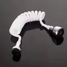White coiled hose with silver fitting on a black reflective surface
